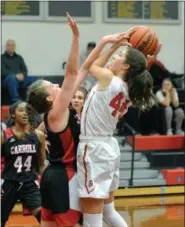  ?? GENE WALSH — DIGITAL FIRST MEDIA ?? Germantown Academy’s Becca Booth goes to shoot as Carroll’s Hope Syron defends.