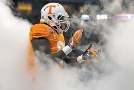  ?? STAFF PHOTO BY C.B. SCHMELTER ?? Tennessee defensive lineman Paul Bain takes the field before the start of Monday night’s Chick-fil-A Kickoff Game against Georgia Tech at Mercedes-Benz Stadium in Atlanta. Bain made a crucial play in the Vols’ 42-41 double-overtime win.