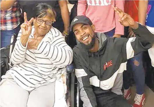  ?? COURTESY PHOTO ?? Comacell Brown Jr. with his grandmothe­r Joyce Johnson, 82, who died from COVID-19 last week after a yearslong battle with cancer.