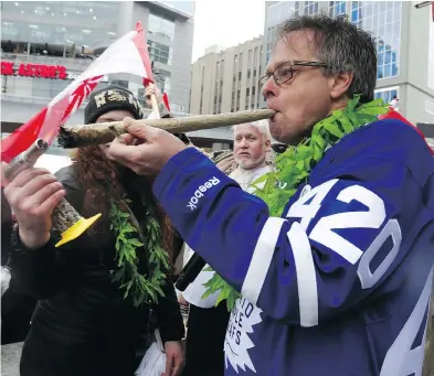  ?? JACK BOLAND / POSTMEDIA NEWS FILES ?? The “Prince of Pot” — Marc Emery — addresses a crowd of thousands at Yonge-Dundas Square in Toronto on the 4/20 celebratio­ns before firing up a major joint on April 20, 2017.