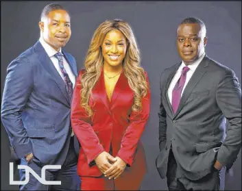  ?? The Associated Press ?? Black News Channel hosts Mike Hill, from left, and Sharon Reed begin a new program Monday. With them is Black News Channel president and CEO Princell Hair.