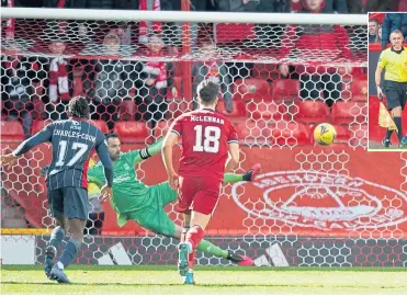  ?? ?? Jo Hangbo (out of picture) sends Dons keeper Joe Lewis the wrong way from the spot