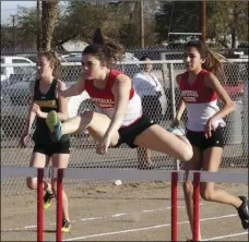  ?? KARINA LOPEZ ?? mperial High’s Jessica Dick (center) leads in the girls’ 100-meter hurdles during a home meet against Holtville High on Thursday.