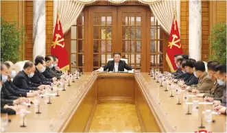  ?? (North Korean Central News Agency/Reuters) ?? NORTH KOREAN leader Kim Jong Un chairs a Worker’s Party meeting in response to a COVID-19 outbreak.