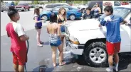  ??  ?? Several members of the Decatur High School cheer team enjoy time together as the team holds a car wash at McLarty Daniels Ford in Bentonvill­e in August. Events like this one are now forbidden due to the coronaviru­s outbreak.
(File Photo/NWA Democrat-Gazette/Mike Eckels)