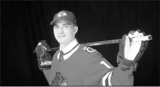  ?? KEVIN LIGHT/GETTY ?? Kirby Dach poses for a portrait after being selected third overall by the Blackhawks during the first round of the 2019 NHL draft.