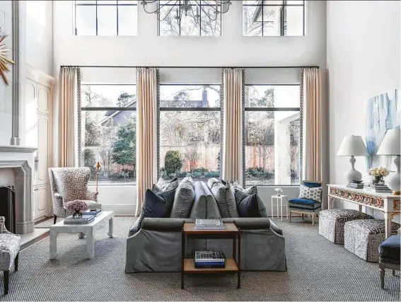  ?? Photos by Kerry Kirk ?? The double-width living room in the Memorial home of Lauren and Jason Long features a two-sided sofa by Paloma Contreras of Paloma Contreras Interior Design.