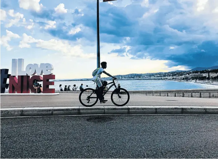  ?? Pictures: Allison Foat ?? COASTING A man cycles towards the Promenade Des Anglais, built in 1820 by the English aristocrac­y, in Nice.