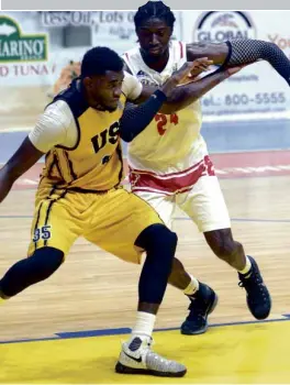  ?? —AUGUST DELA CRUZ ?? UST's Steve Akomo and Eugene Toba of San Beda fight for position inside the paint.