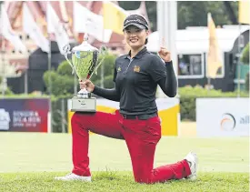  ??  ?? Preenaphan Poomklay holds the Singha Hua Hin Open trophy.