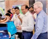  ??  ?? Softlogic Holdings PLC Chairman Ashok Pathirage making the first purchase at Softlogic GLOMARK Nawala as Softlogic Holdings PLC CEO Andrew Dalby looks on