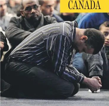  ?? PAUL CHIASSON/AFP/ GETTY IMAGES ?? Mourners pray during funeral services for victims of the massacre at the Quebec Islamic Cultural Centre in Quebec City on Feb. 3. Nine months later, Muslim leaders say members of the community are still being targeted for abuse.