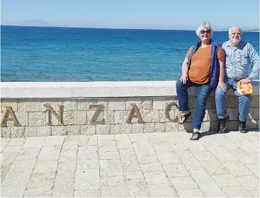  ??  ?? Warragul couple Magret Rae and Terry Hennessy at Anzac Cove in Gallipoli before they began feeling the symptoms of coronaviru­s.