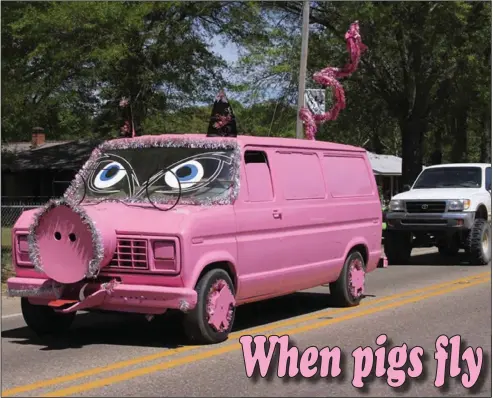  ?? Contribute­d Photo ?? Big Pink Piggy: A large pink van that has been modified to look like a pig is a staple at the Hogskin Holiday Festival.