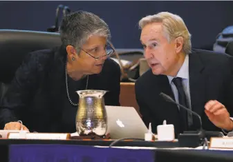  ?? Paul Chinn / The Chronicle 2017 ?? University of California President Janet Napolitano confers with Board of Regents Chairman George Kieffer during a 2017 meeting. A student had accused Kieffer of sexual harassment.