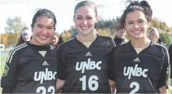  ?? CITIZEN PHOTO BY JAMES DOYLE ?? UNBC Timberwolv­es seniors Jenna Wild, left, Ashley Volk, and Julia Babicz pose for a photo on Sunday afternoon at Masich Place Stadium after playing in their final home game in Timberwolv­es colours.
