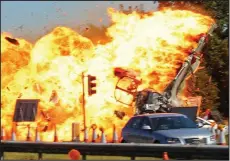  ??  ?? Fireball: The Hawker Hunter jet crashes into traffic