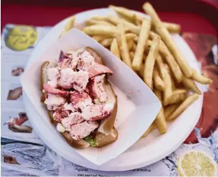  ?? HANNAH SELINGER For The Washington Post ?? A lobster roll with fries at Bob Lobster.