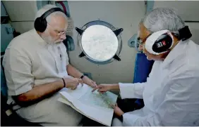  ??  ?? Prime Minister Narendra Modi and Bihar chief minister Nitish Kumar conduct an aerial survey of floodaffec­ted areas in the state on Saturday. After the aerial survey, the Prime Minister announced a `500-crore relief package for Bihar, where 418 people...