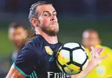  ?? AFP ?? Madrid’s Gareth Bale controls the ball against Manchester City during their ICC match in Los Angeles on Wednesday.