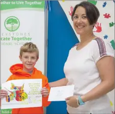  ??  ?? Riley Justice from the Greystones Educate Together, who was a winner of the National Sealife Baby Stingray colouring competitio­n, with his teacher Ciara Fagan.