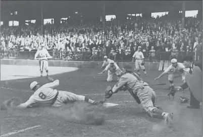  ?? Jack Herod Los Angeles Times ?? IN A HOLLYWOOD STARS game in 1939, a baserunner beats the catcher’s tag to score a run. The Stars played in the Pacific Coast League and had several celebritie­s as part-owners, including Gene Autry, who later owned the Angels.