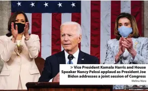  ?? Melina Mara ?? > Vice President Kamala Harris and House Speaker Nancy Pelosi applaud as President Joe Biden addresses a joint session of Congress