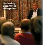  ??  ?? Listening... Jeremy in village hall