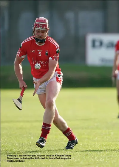  ??  ?? Glenealy’s Joey Driver gets his pass away as Kiltegan’s Rory Finn closes in during the SHC clash in Joule Park Aughrim. Photo: Joe Byrne