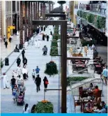  ?? — Photo by Yasser Al-Zayyat ?? KUWAIT: Kuwaitis walk as others sit on cafe terraces inside the Avenues Mall, the country’s largest shopping centre.