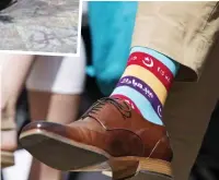  ??  ?? Putting his foot in it: Trudeau in Star Wars socks and, right, his Ramadan-themed rainbow pair