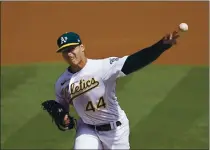  ?? JEFF CHIU — THE ASSOCIATED PRESS ?? The A’s Jesus Luzardo (44) pitches against the Giants during the first inning on Saturday in Oakland.