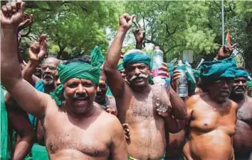  ?? PTI ?? Farmers from Tamil Nadu shout slogans during a protest to demand loan waivers and drought relief funds at Jantar Mantar in New Delhi on Saturday.