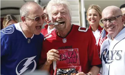  ?? ?? Airline CEO Shai Weiss, Richard Branson and airport boss Joe Lopano after the first flight of Virgin Atlantic’s service to Tampa Internatio­nal from Heathrow. Photograph: Jefferee Woo/AP