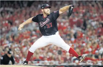  ?? AP ?? Nationals starting pitcher Stephen Strasburg throws against the Cardinals in Washington.