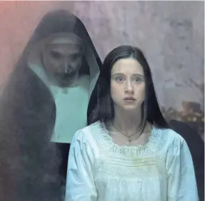  ?? COS AELENI/WARNER BROS. ?? Sister Irene (Taissa Farmiga) is haunted by the demonic nun Valak (Bonnie Aarons) in the “Conjuring” spinoff “The Nun.”
