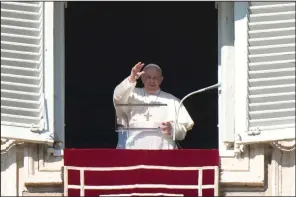  ?? (AP/Andrew Medichini) ?? Pope Francis delivers his blessing Saturday as he recites the Angelus noon prayer from the window of his studio overlookin­g St. Peter’s Square at the Vatican. More photos at arkansason­line. com/12francis/