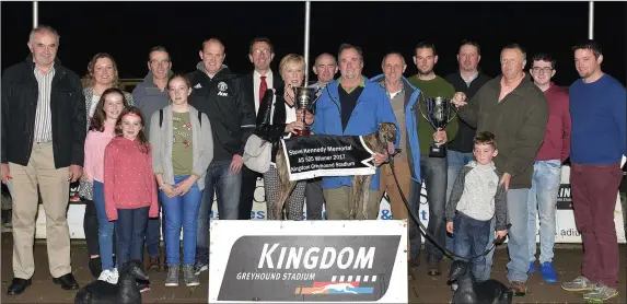  ??  ?? Representi­ng the Kennedy family Mary Kennedy presents the winner’s trophy to trainer/owner Oliver Healy (Tralee) after Dramatic Rosie won the Steve Kennedy Memorial Stake final at the Kingdom Stadium last Friday. Included, from left, Jerome Kennedy,...