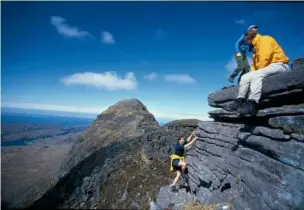  ??  ?? Rucksacks ditched for ease of movement, tackling the final pull up to one of Suilven’s two distinct summits.