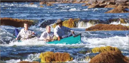  ?? ?? In a foldable boat, the expedition team negotiates a rapid on the Rio Verde in Serra Ricardo Franco, Mato Grosso, Brazil on July 25, 2001.