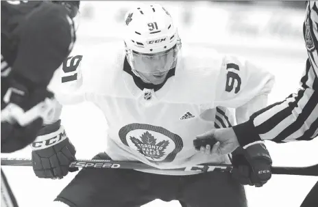  ?? DAVE ABEL ?? Toronto centre John Tavares prepares for a faceoff during the Maple Leafs’ first day of training camp on Friday in Niagara Falls, Ont. The free-agent acquisitio­n commanded much of the attention during the scrimmage, showcasing his skill immediatel­y alongside winger Mitch Marner.