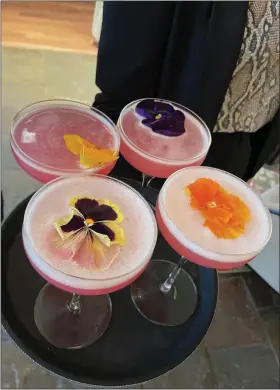  ?? ?? Cocktails are served - complete with edible flowers - as part of the Westin Copley Place’s Culinary Experience.