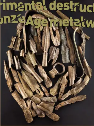  ??  ?? A large Late Bronze Age hoard, dredged from Duddingsto­n Loch in 1778 and now displayed at the National Museum of Scotland, Edinburgh: burnt, bent and broken weapons include a complete sword blade nearly bent double