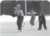  ?? ?? Kids take skating lessons at a rink behind Yellowston­e Park School in Yellowston­e National Park in Wyoming.