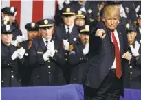  ?? EVAN VUCCI/THE ASSOCIATED PRESS ?? President Donald Trump points to the crowd Friday after speaking to law enforcemen­t officials on the street gang MS-13 in Brentwood, N.Y.