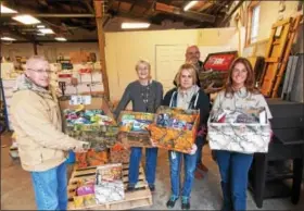  ?? LISA MITCHELL - BERKS-MONT NEWS ?? Cabela’s in Hamburg dropped off donations to Keystone Military Families in Shoemakers­ville on Dec. 9. Left to right are Victor Ahearne, Cabela’s asset protection manager; Kyle Lord of Keystone Military Families; Melissa LaRocca, Cabela’s customer...