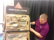  ?? Staff photo by Lori Dunn ?? Ricky James of Acme Brick in Texarkana sets up part of a display Friday for the annual Texarkana Home Builders Associatio­n’s Home and Garden Show. The show starts today at Texarkana, Texas, Convention Center on Cowhorn Creek.