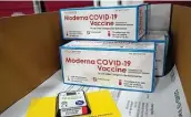  ?? Paul Sancya / Associated Press ?? Boxes containing the Moderna vaccine are prepared to be shipped at the McKesson distributi­on center in Olive Branch, Miss., Sunday.