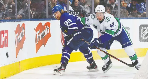  ?? — GETTY IMAGES FILES ?? Quinn Hughes of the Canucks battles William Nylander of the Leafs. The defenceman has been trusted in a shutdown role.