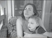  ?? Robin Rayne / ZUMA ?? Sarah Allen, holding her son Aidan, may soon be homeless because the house where she lives will be sold, and she has limited resources to find another home suitable for a severely disabled child.